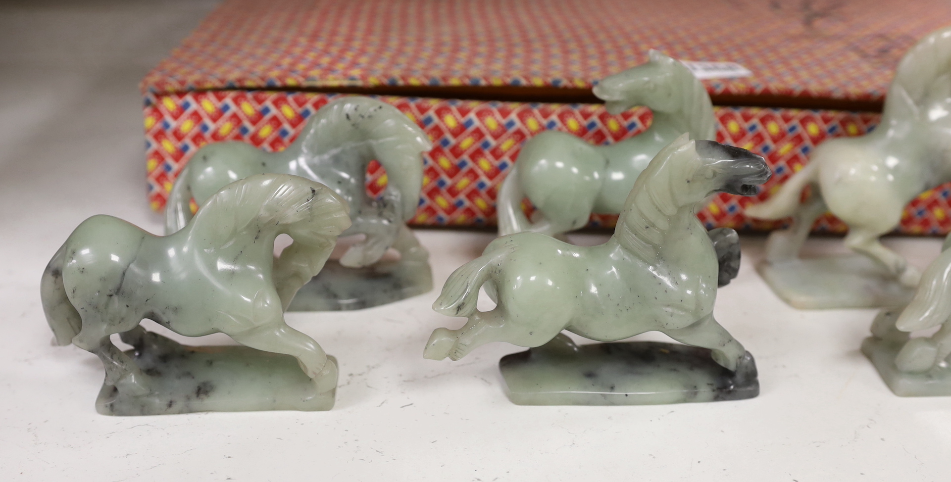 A set of eight Chinese hardstone figures of the horses of Mu Wang